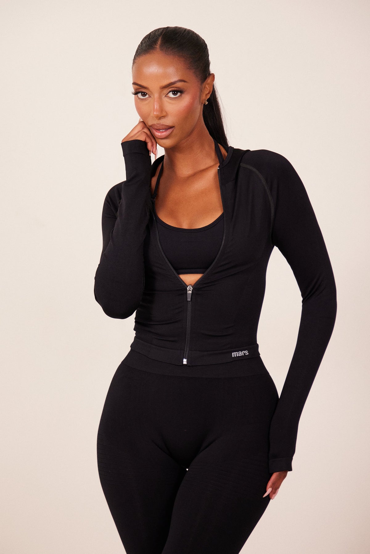 The Mars Seamless Hooded Zip Jacket in Black
